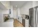 Modern, galley kitchen featuring stainless steel appliances, and quartz countertops at 2575 Peachtree Ne Rd # 15F, Atlanta, GA 30305