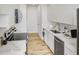 Modern kitchen features stainless steel appliances, elegant white countertops, and light wood flooring at 2575 Peachtree Ne Rd # 15F, Atlanta, GA 30305