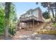 Multi-level deck with stairs, offering an inviting outdoor space and a lush backyard at 3741 Cape York Trce, Alpharetta, GA 30022