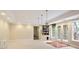 Finished basement features white walls, recessed lighting, french doors, and tile flooring at 3741 Cape York Trce, Alpharetta, GA 30022