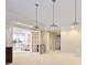Open basement features pendant lights and access to an adjacent seating area at 3741 Cape York Trce, Alpharetta, GA 30022