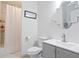 Clean, well-lit bathroom featuring a vanity with storage, a toilet, and a shower with curtain at 3741 Cape York Trce, Alpharetta, GA 30022