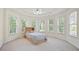 Bright bedroom with a ceiling fan and lots of natural light from multiple windows at 3741 Cape York Trce, Alpharetta, GA 30022