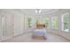 Bedroom features a tray ceiling and several windows that provide ample natural light at 3741 Cape York Trce, Alpharetta, GA 30022