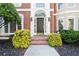 Inviting front entrance with elegant brick steps, decorative shrubs, and stylish outdoor lighting at 3741 Cape York Trce, Alpharetta, GA 30022
