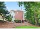 Exterior side view showcasing a two-story home with brick and siding, and a bay window at 3741 Cape York Trce, Alpharetta, GA 30022