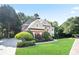 Charming brick home with well-maintained lawn, showcasing its inviting facade and neighborhood setting at 3741 Cape York Trce, Alpharetta, GA 30022