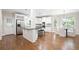 Bright kitchen with stainless steel appliances, granite countertops, an island with bar seating, and a breakfast area at 3741 Cape York Trce, Alpharetta, GA 30022