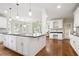 Large kitchen with a central island, granite countertops, and white cabinets offering ample storage at 3741 Cape York Trce, Alpharetta, GA 30022