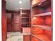 Library showcasing dark wood shelving, cabinet lighting, and tile flooring at 3741 Cape York Trce, Alpharetta, GA 30022