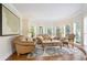 Cozy living room with bay windows, plush seating, and elegant decor, creating a comfortable space at 3741 Cape York Trce, Alpharetta, GA 30022