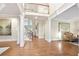 Bright and airy living room with hardwood floors, featuring a staircase and elegant architectural details at 3741 Cape York Trce, Alpharetta, GA 30022