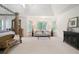 Comfortable main bedroom seating area with windows and natural light at 3741 Cape York Trce, Alpharetta, GA 30022