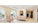 Sitting room showcasing neutral walls, recessed lights, and windows dressed with sheer, tie-back curtains at 3741 Cape York Trce, Alpharetta, GA 30022