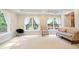 Sitting room with large windows, lots of natural light, and carpeted floors at 3741 Cape York Trce, Alpharetta, GA 30022