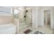 Modern bathroom featuring a glass enclosed shower and a tub at 610 Brickstone Ct, Covington, GA 30016