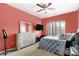 Inviting bedroom features a light wall color, dresser and a large window at 610 Brickstone Ct, Covington, GA 30016