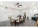 The dining room has a modern table and chairs set with an outdoor hot tub at 610 Brickstone Ct, Covington, GA 30016