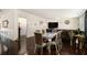 Spacious dining area with dark wood floors and seating for six at 610 Brickstone Ct, Covington, GA 30016