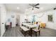 Bright dining area with modern table and seating, plus views of the backyard from an exterior door at 610 Brickstone Ct, Covington, GA 30016