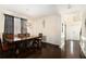 Formal dining room with dark hardwood floors, wainscoting, and decorative lighting at 610 Brickstone Ct, Covington, GA 30016