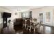 Traditional dining area features hardwood floors and a modern dining table at 610 Brickstone Ct, Covington, GA 30016
