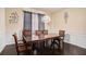 Inviting dining room with hardwood floors, a decorative light fixture, and stylish decor at 610 Brickstone Ct, Covington, GA 30016