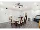Bright dining area with modern table and seating, plus a view of the backyard and a jacuzzi tub at 610 Brickstone Ct, Covington, GA 30016