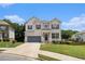 Charming painted brick home with an attached garage, landscaping, and a welcoming front porch and doorway at 610 Brickstone Ct, Covington, GA 30016