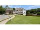 Charming two-story home with well-maintained lawn and landscaping, plus a long driveway to the attached garage at 610 Brickstone Ct, Covington, GA 30016