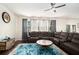 Cozy living area with large sectional sofa and bright accent rug at 610 Brickstone Ct, Covington, GA 30016