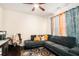 Comfortable living room with a gray sectional, decorative pillows, and natural lighting at 610 Brickstone Ct, Covington, GA 30016