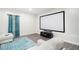 Enjoy movie nights in this cozy media room with ample seating and large screen at 610 Brickstone Ct, Covington, GA 30016