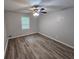 Bedroom with vinyl floors and modern ceiling fan at 636 Raven Springs Trl, Stone Mountain, GA 30087