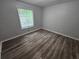 Bedroom with vinyl floors and window view at 636 Raven Springs Trl, Stone Mountain, GA 30087