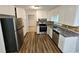 Modern kitchen featuring granite countertops, stainless steel appliances, and ample cabinet space at 636 Raven Springs Trl, Stone Mountain, GA 30087