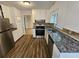 Beautiful kitchen with stainless steel appliances, granite countertops, and modern fixtures at 636 Raven Springs Trl, Stone Mountain, GA 30087