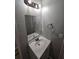 A half bath featuring a vanity, sink, lighting and fixtures at 636 Raven Springs Trl, Stone Mountain, GA 30087