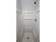 A stand up shower with white shower surround, head and fixtures at 636 Raven Springs Trl, Stone Mountain, GA 30087