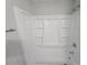 Bright white shower features built in shelving at 636 Raven Springs Trl, Stone Mountain, GA 30087
