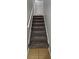 Carpeted stairs lead to the upper level of the home at 636 Raven Springs Trl, Stone Mountain, GA 30087