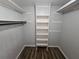 Large walk-in closet with custom shelving providing ample storage space at 636 Raven Springs Trl, Stone Mountain, GA 30087
