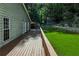 The back deck area offers a serene outdoor space for relaxation, overlooking the well-maintained backyard and lush surroundings at 1920 Daves Creek Trl, Cumming, GA 30041