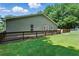 The home's expansive wood deck stretches along the back providing ample room for outdoor relaxation and recreation at 1920 Daves Creek Trl, Cumming, GA 30041