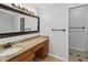 Bathroom with a granite countertop vanity, mirror, and a towel bar at 1920 Daves Creek Trl, Cumming, GA 30041