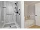 Bathroom featuring bathtub, and accessible shower at 1920 Daves Creek Trl, Cumming, GA 30041