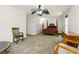 Large bedroom featuring a four-poster bed, a ceiling fan, carpet, and plenty of natural light at 1920 Daves Creek Trl, Cumming, GA 30041