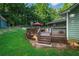 Deck features outdoor seating, perfect for relaxing and enjoying the backyard of this home at 1920 Daves Creek Trl, Cumming, GA 30041