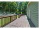 Large wooden deck with a railing, perfect for outdoor entertaining and relaxation at 1920 Daves Creek Trl, Cumming, GA 30041