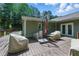 Spacious wooden deck with outdoor furniture, ideal for entertaining and relaxing at 1920 Daves Creek Trl, Cumming, GA 30041